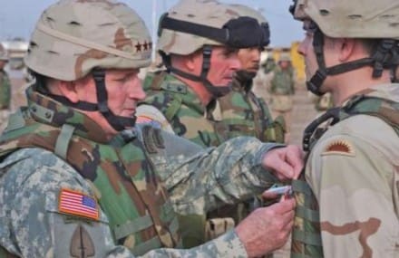 Army Chief of Staff, Gen. Peter J. Schoomaker awards Vancouver, WA resident Cpl. Patrick Eldred, Company B, 2nd of the 162 Infantry, 39th Brigade Combat Team the Bronze Star with (V) device during a ceremony on Camp Taji, Dec 26. (US Army Photo by Cpl Benjamin Cossel, 122nd MPAD)