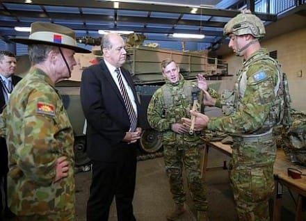 Chief of Army, Lieutenant General David Morrison (left), AO, and Defence Minister, Senator David Johnston, receive a briefing on Army's new Land 125 Phase 3B soldier equipment and the enhanced F88 Austeyr rifle from Australian Army soldiers Corporal Lachlan Robinson (centre) and Lance Corporal Aaron Williams (right) from 1st Battalion, Royal Australian Regiment, at the Australian Defence Force Academy on 28 August 2014. 
