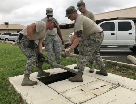 132d Communications Flight Airman from the 132d Wing, Iowa Air National Guard open up a manhole cover while working on underground cables February 22, 2018, at Joint Base Pearl Harbor-Hickam in Honolulu, Hawaii. The 132d CF Airmen inventoryed equipment, disposed of outdated computer hardrives and performed maintenance on underground network cables. (U.S. Air National Guard photo by Staff Sgt. Michael J. Kelly)