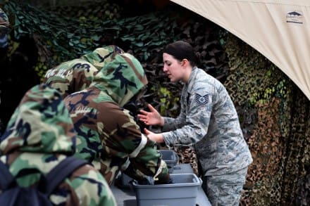 Tech. Sgt. Rachel Albee, 132d Wing Emergency Managment, instructs Hawaii Airmen in proper decontamination tactics February 13, 2018, at Joint Base Pearl Harbor-Hickam in Honolulu, Hawaii. The 132d EM trained approximately 466 active duty, Guard and Reserve Airmen. (U.S. Air National Guard photo by Staff Sgt. Michael J. Kelly)